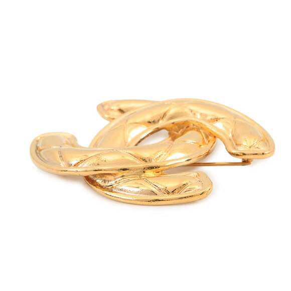 CHANEL Gold Logo Brooch